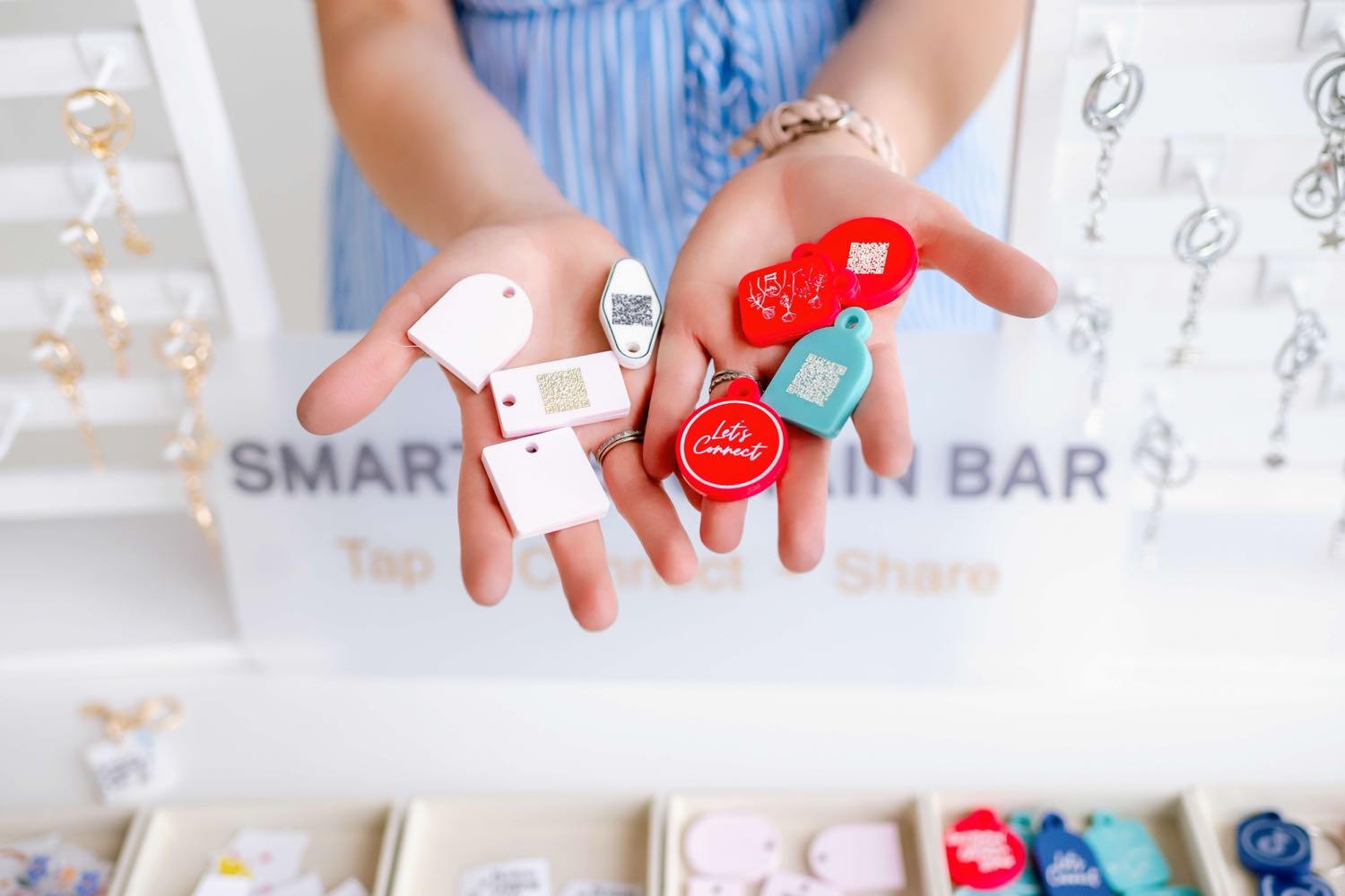 A handful of colorful TapLoop keychains at the keychain bar